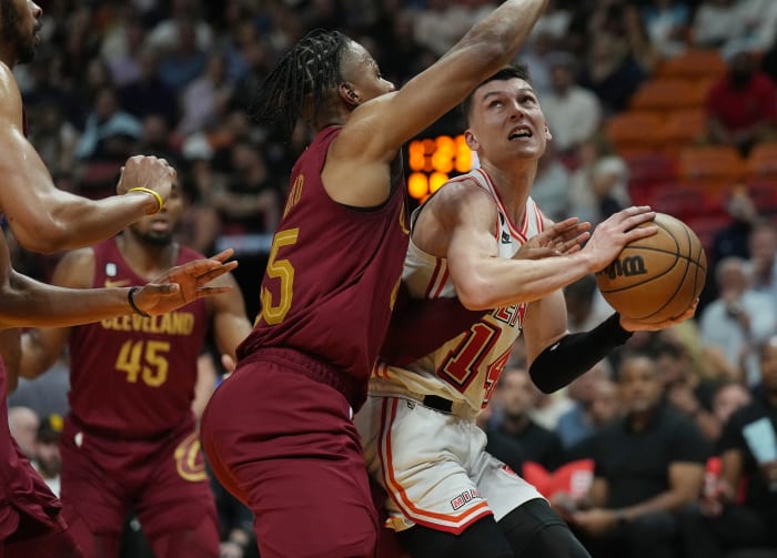 Mar 10, 2023; Miami, Florida, USA; Miami Heat guard Tyler Herro (14) looks to take a shot as Cleveland Cavaliers forward Isaac Okoro (35) defends in the first half at Miami-Dade Arena. Mandatory Credit: Jim Rassol-USA TODAY Sports